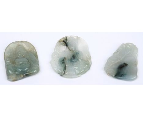 A Chinese celadon jade pendant: carved on one side with a seated Buddah, together with two other small pendants, (3).

