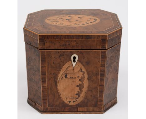 A George III burr wood and inlaid tea caddy: of rectangular form with canted corners, the hinged lid with conch shell inlaid 
