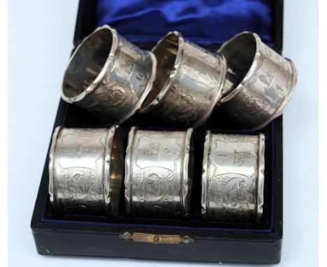 A cased set of six Edward VII silver napkin rings, maker Williams Limited, Birmingham 1901, numbered 1-6 and engraved with ho