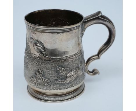 A George II silver tankard, maker Charles Hatfield, London, 1731: with later embossed hunting dog decoration, S-shaped scroll