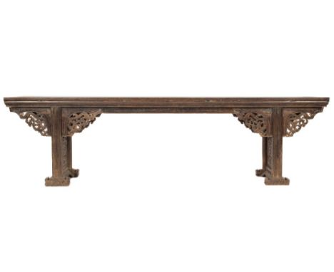 A 19th Century Chinese carved hardwood altar table:, with a rectangular moulded top, the shaped apron with pierced foliate sc