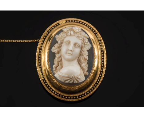 A late 19th century French gold and oval hardstone cameo portrait brooch:, the oval hardstone cameo 35mm wide x 26mm long wit