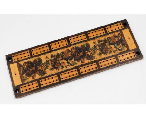 A 19thC. Tunbridgeware cribbage board with original Tunbridge Wells label to verso, 10.25in wide x 3.5in deep