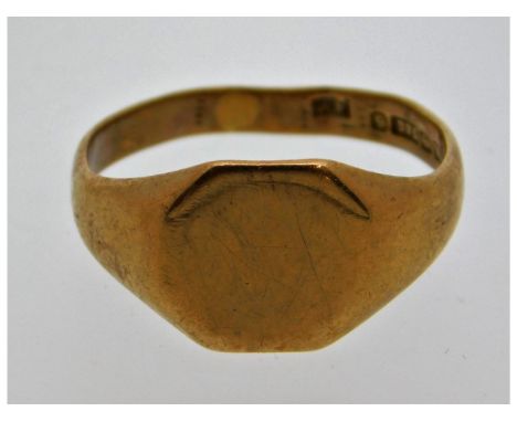 A 9ct gold signet ring, slightly misshapen, size V. 4.4g