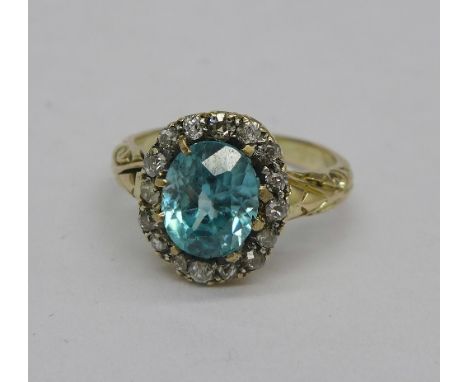 A blue zircon and diamond cluster ring, 2.39 carat zircon weight, weight 3.2g, size K, no hallmark