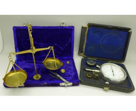 A set of scales and a gauge marked Haster, Bern, both boxed