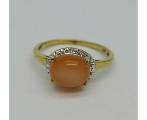 A silver-gilt peach moonstone ring with diamond accents, size T