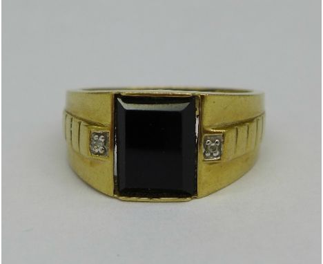 A 9ct gold black stone and diamond ring, weight 3.1g, size R