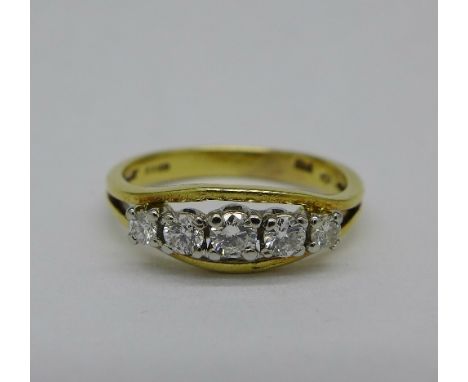 An 18ct gold five stone diamond ring, 0.35 carat diamond weight, 3.1g, M