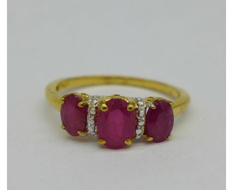 A silver-gilt ruby trilogy ring, size Q/R