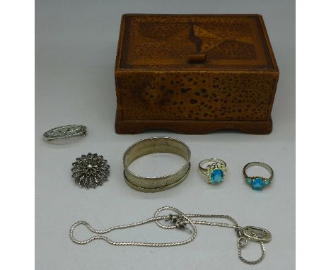 A silver napkin ring, silver jewellery in a parquetry box, with inscription dated 1947 to base