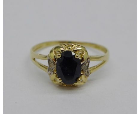 A 9ct gold, sapphire and diamond ring, weight 1.2g, size O