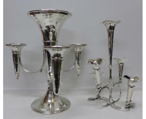 A plated four trumpet epergne and a plated five trumpet epergne, height of tallest 35cm
