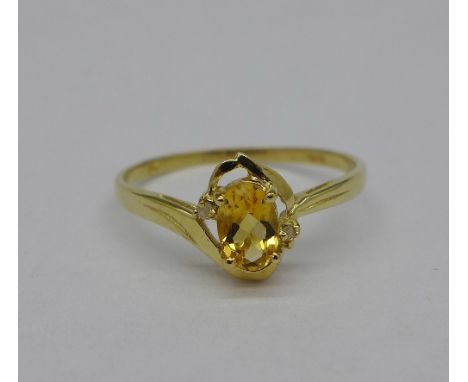 A 9ct gold, citrine and diamond ring, weight 0.9g, size P