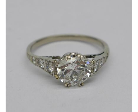 A diamond Art Deco ring with diamond set shoulders, 1.18 carat centre diamond weight, approximately 1.4 carat total diamond w