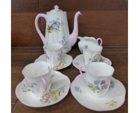 A part Shelley Wild Flowers coffee service; pot, cream jug and four coffee cans and saucers