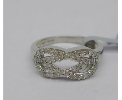 A limited edition silver and diamond ring, total diamond weight 0.35ct, forty-four diamonds with certificate, N