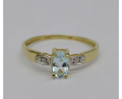 A 9ct gold, diamond and blue stone ring, weight 0.9g, size O