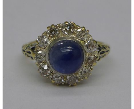 An 18ct gold, cabochon sapphire and diamond cluster ring, 4.2 carat sapphire weight, weight 5.3g, size P