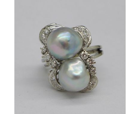 A diamond and pearl set ring, marked 585, approximately 0.35 carat total diamond weight, weight 10.2g, size P