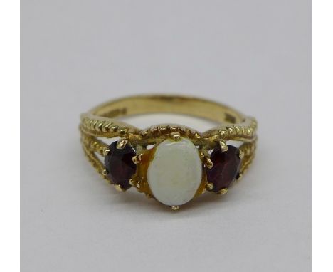 A 9ct gold, opal and garnet ring, weight 2.6g, size L