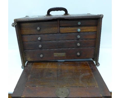 A six drawer chest with front cover and carrying handle, with plaque marked J.M. Waterston, Tools & Cutlery, Detroit, Michiga