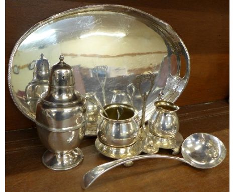 An E.P.B.M. stand with cream and sugar, an A1 plated ladle, a plated gallery tray, a shaker and a sifter spoon