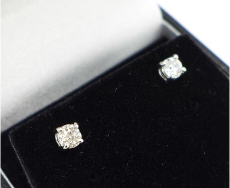 A pair of 18ct white gold set, diamond stud earrings, 0.8 carat total diamond weight