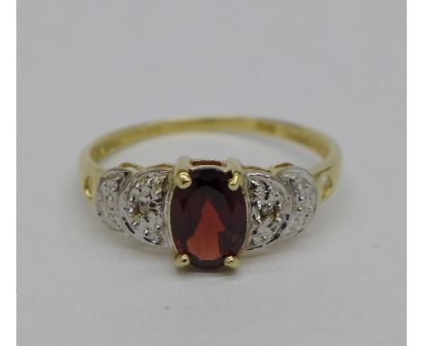 A 9ct gold, garnet and diamond ring, weight 1.4g, size O