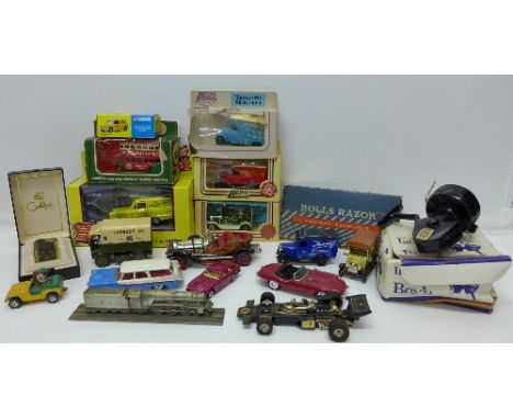 Die-cast vehicles including Lledo and Corgi, some boxed, a Rolls razor, Colibri lighter and an Intrepid fishing reel, boxed