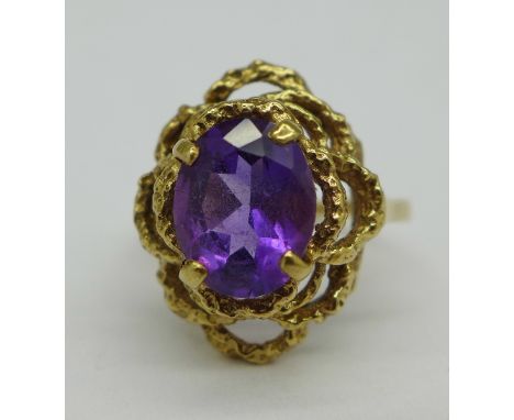 A 9ct gold and purple stone set ring, weight 4.3g, size N