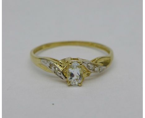 A 9ct gold, topaz and diamond ring, weight 0.8g, size N