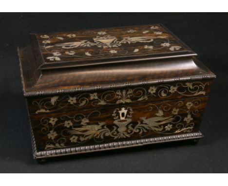 Mid 19th century rosewood and mother of pearl marquetry inlaid sewing box of sarcophagus form having a fitted and lined inter