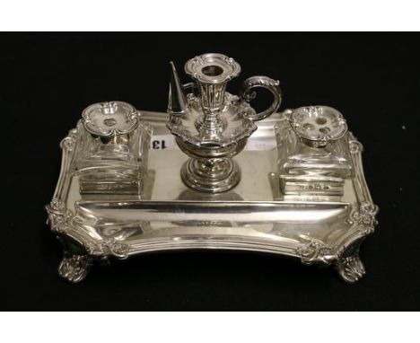 Silver ink stand of angled rectangular shape with two mounted glass receivers flanking a central taperstick and snuffer, Henr