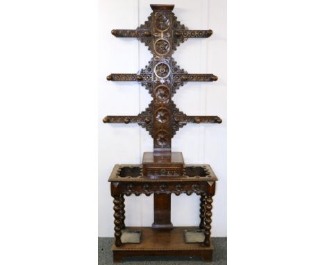 Victorian carved oak hat tree with drawer and two stick stands with drip trays, 220cm tall