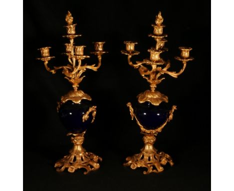 Pair of French five light candelabra, the Royal blue porcelain bodies mounted with ormulu bases and surmounts, 58cm tall