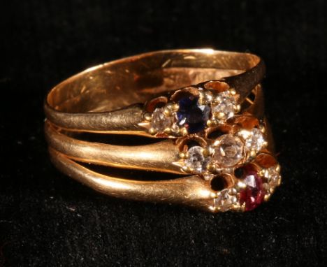 Triple three stone ring with a sapphire, a ruby and diamond flanked by smaller diamonds