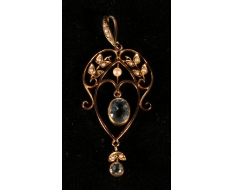 Aquamarine and pearl pendant in gold CONDITION REPORT: One pearl missing on left hand side
Large stone has some scratching on