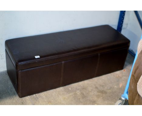 A MODERN PADDED OTTOMAN CONTAINING JUG KETTLES, TOASTER, ANGLE LAMP ETC     