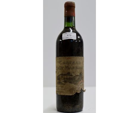 A VINTAGE BOTTLE OF CHATEAU HAUT - MARBUZET 1964 RED WINE