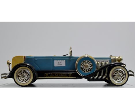 A NOVELTY VINTAGE JIM BEAM 100 MONTHS OLD WHISKEY DECANTER MODELLED AS A CLASSIC CAR - 750ML, 80° PROOF     