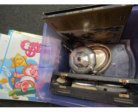 A cased enamel set of hairbrush etc and a selection of plated wares, Care Bear volumes etc.