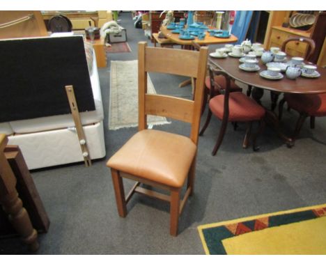 A set of six modern brown leather seated ladder back chairs on stretcher bases