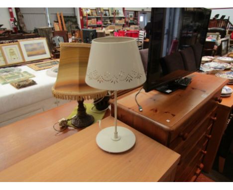 A cream Laura Ashley pierced metal table lamp and a Shabby-Chic style bedside table lamp with white and blue linen shade and 