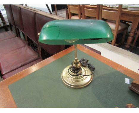 A modern banker's lamp with green shade