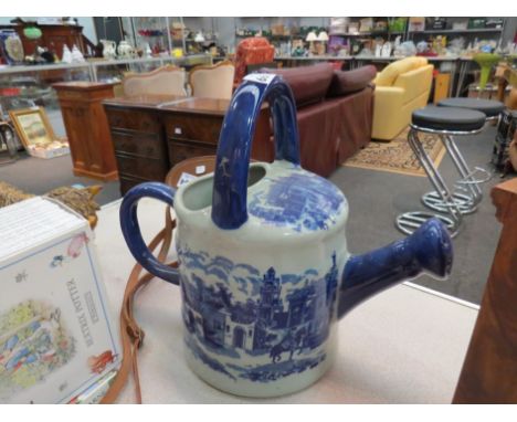 A Victorian style blue and white ceramic watering can