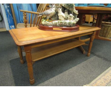 A handcrafted light oak coffee table with undertier
