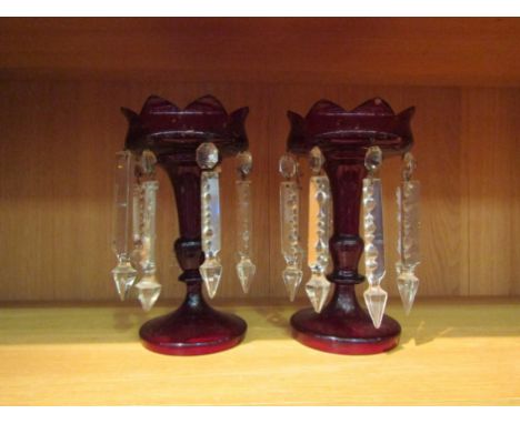 A pair of ruby glass lustres, a/f damaged rims 