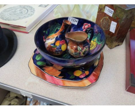 A selection of H &amp; K Tunstall items including "Iris" and "Autumn" plates, "Viola" and another jug and a large floral desi