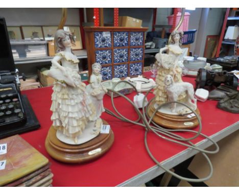 A pair of figural lady lamp bases